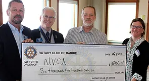 Past President Gary Kopp and project chair Jody Hatfield present cheque to N.V.C.A. representatives