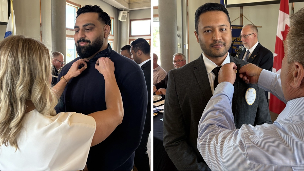 Jatin Kumar and Aditya being inducted into the Rotary Club of Barrie